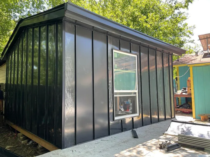 Black standing seam metal wall panels for Roof Inspection in Lubbock
