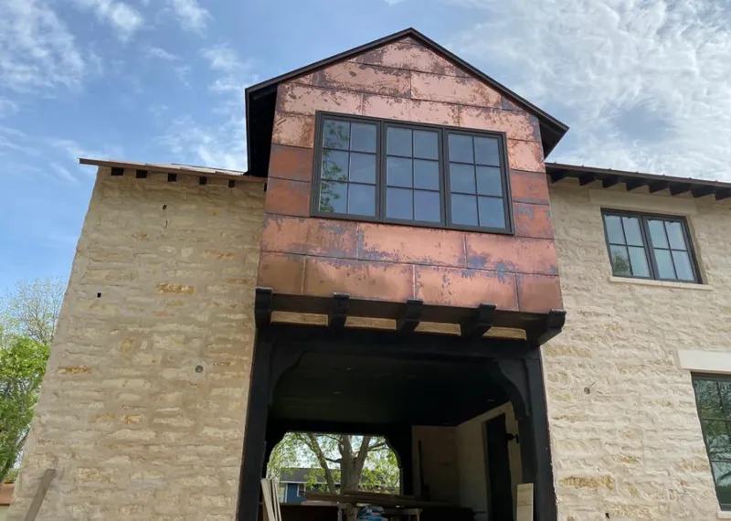 Copper metal panel facade on a stone building for Skylight Installation in Lubbock